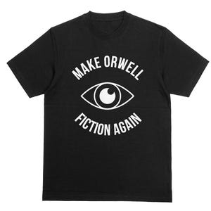 May include: Black t-shirt featuring the white text "MAKE ORWELL FICTION AGAIN" and a white eye graphic. The t-shirt has a crew neck.