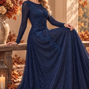May include: A floor-length navy blue long-sleeve gown featuring a shimmering glitter finish and intricate floral applique detailing that extends from the shoulder down to the waistline, with a round neckline and a full, flowing skirt.