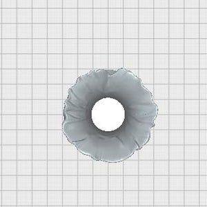 May include: A top-down view of a gray, ruffled scrunchie with a white center. The scrunchie is made of a soft, textured fabric and is set against a grid background.