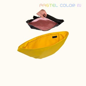May include: Two open handbags. The top bag is black with a pink interior. The bottom bag is yellow. The text "PASTEL COLOR IN" is at the top of the image.