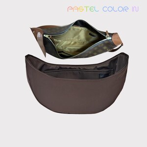 May include: Two brown shoulder bags are displayed, one open to reveal a gold interior and the other closed. The top bag has a zipper closure and a brown leather handle. The text "PASTEL COLOR IN" is displayed in rainbow colors.