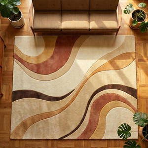 May include: A rectangular area rug with a flowing, abstract design in shades of beige, brown, and rust. The rug is placed on a hardwood floor, with a mid-century modern sofa and potted plants visible in the background. The rug's design features curved lines.