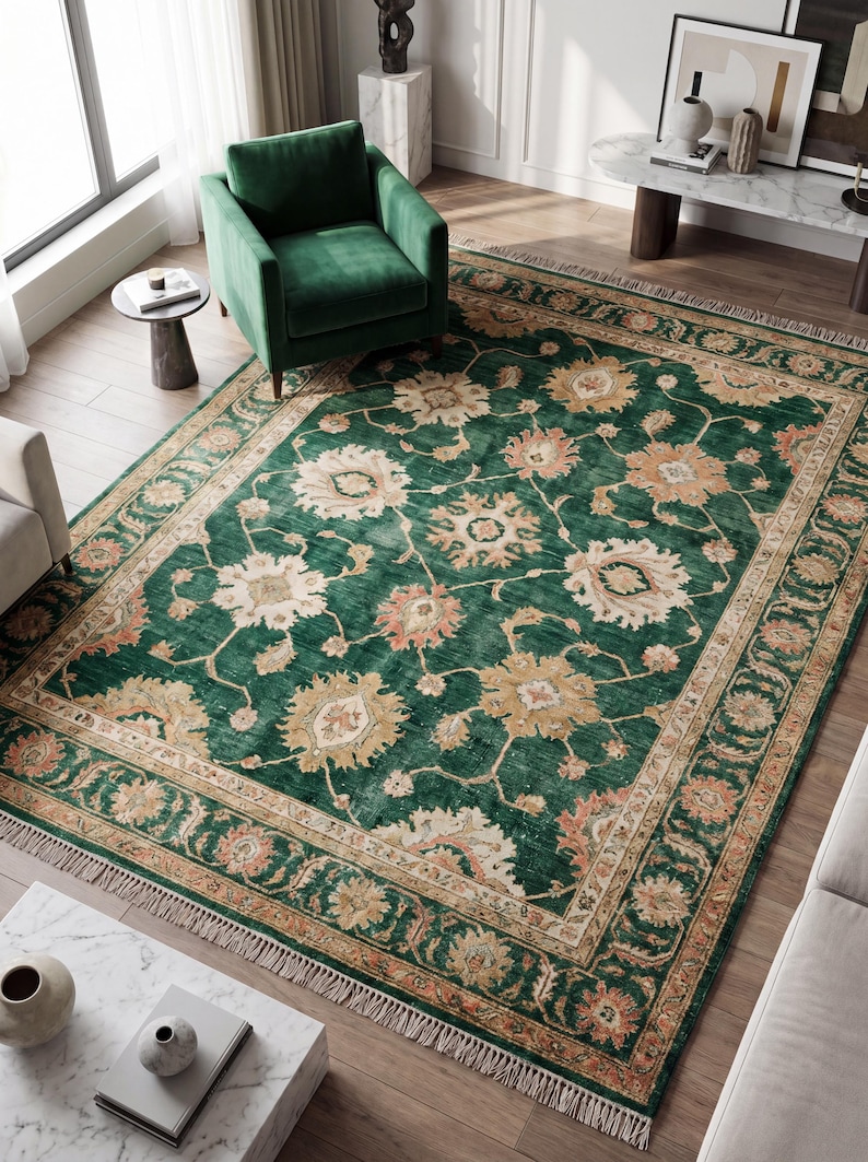 Hand knotted green floral rug carpet in Oushak Persian style placed in modern living room with neutral furniture and wood flooring