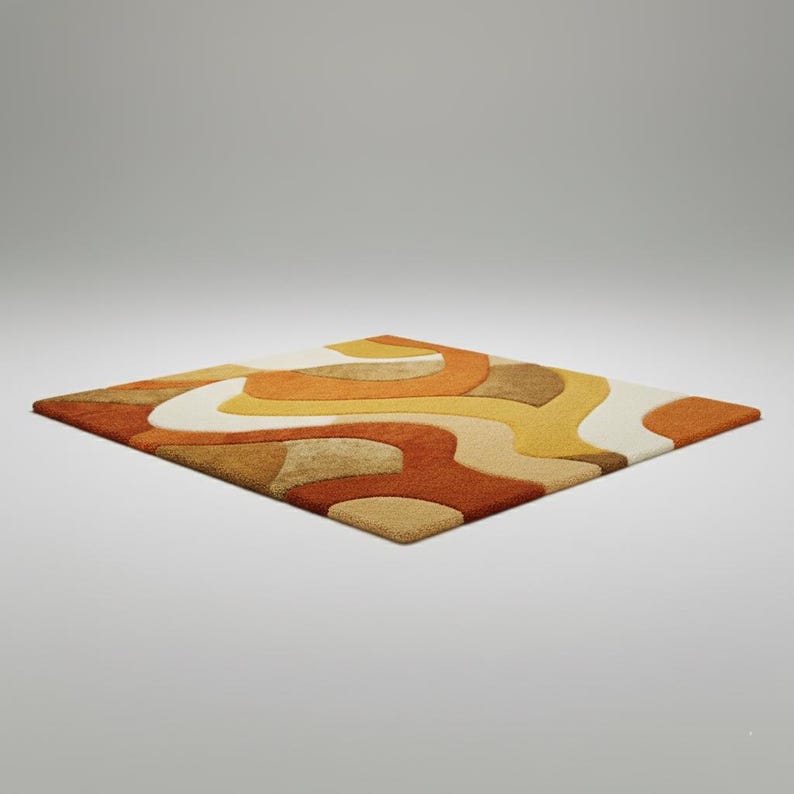 May include: A square rug with a retro design. The rug features a pattern of flowing, organic shapes in shades of orange, yellow, brown, and cream. The rug is made of a soft, textured material and is suitable for a living room or bedroom.