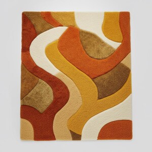 May include: A rectangular rug with a retro design. The rug features a pattern of flowing, organic shapes in shades of orange, yellow, brown, and cream. The rug has a textured, plush appearance, suggesting a soft and comfortable feel.