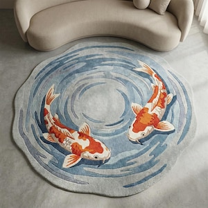 Hand tufted round wool rug with koi fish swimming in blue water pattern