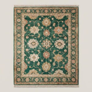 Green floral Oushak rug carpet with traditional Persian motifs styled under armchair in contemporary interior setting