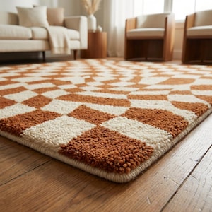 Rectangular modern tufted rug featuring abstract wavy checkerboard pattern in warm terracotta tones