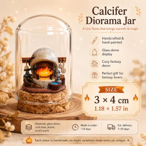 May include: A Calcifer diorama jar featuring a miniature orange flame character inside a stone-colored hearth, enclosed in a clear glass dome on a cork base. The display includes kitchen tools and measures 3 by 4 cm or 1.18 by 1.57 inches.