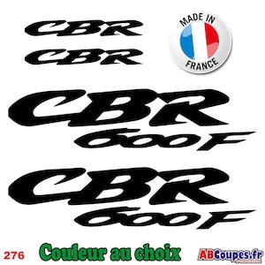 May include: Black CBR and CBR 600F motorcycle decals. Includes a "Made in France" sticker. The text "Couleur au choix" is also visible. The decals are in a bold, sans-serif font.