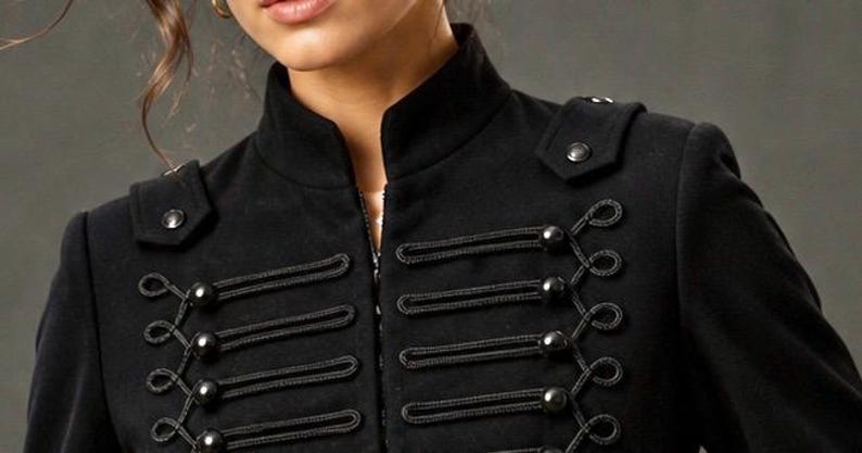 May include: Black military-style jacket with a high collar and decorative rope and button closures. The jacket features shoulder epaulettes with button details and a zipper closure. A stylish and unique outerwear piece.