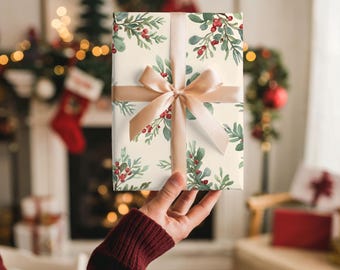 May include: A wrapped gift with cream-colored paper featuring a pattern of green leaves and red berries. A tan ribbon is tied around the gift in a bow. The background includes a fireplace and Christmas decorations.