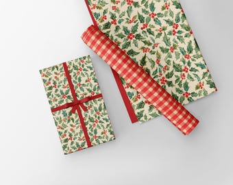 May include: A wrapped gift with a red ribbon, a roll of red and white checkered paper, and a sheet of paper with a holly and berry pattern. The wrapping paper has a cream background with green leaves and red berries.
