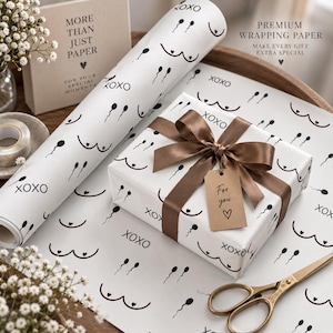 May include: A roll and a sheet of white wrapping paper featuring a repeating black pattern of sperm icons, breast outlines, and the text XOXO. A gift box is wrapped in the paper, tied with a brown satin ribbon and a brown paper tag reading For you.