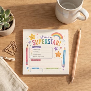 May include: A square notepad featuring the text You're a SUPERSTAR! with a rainbow, smiling stars, and two pencils. The form includes checkboxes for Great attitude, Helpful friend, Excellent effort, and Amazing participation, plus lines for comments, date, and teacher signature.