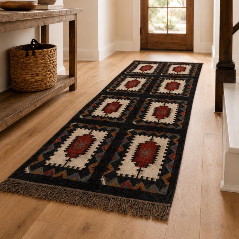 Bohemian black geometric rug with aztec tribal medallion pattern, handwoven wool and jute flatweave, rustic boho living room decor