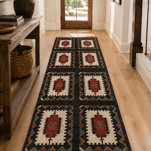 Dark charcoal geometric tribal rug with cream center medallions and rust red accent, handwoven flatweave wool jute, boho farmhouse decor