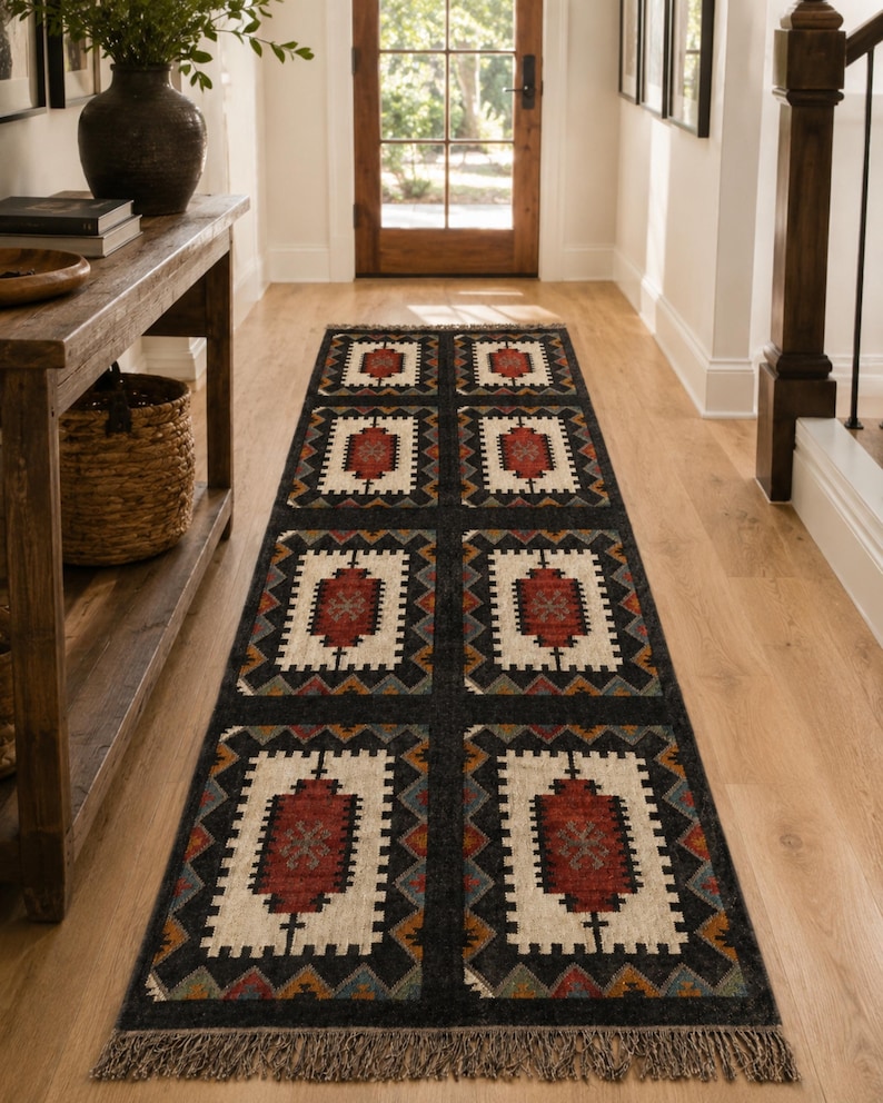 Dark charcoal geometric tribal rug with cream center medallions and rust red accent, handwoven flatweave wool jute, boho farmhouse decor