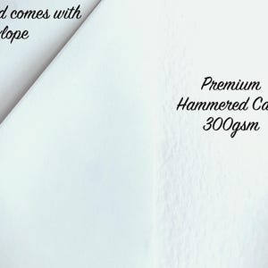 May include: A white card with a textured surface, accompanied by an envelope. The card is labeled "Premium Hammered Card 300gsm" and the text "Card comes with Envelope" is also visible.