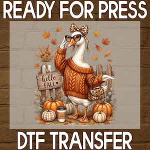 May include: A DTF transfer featuring a white goose wearing a cable-knit orange sweater, leopard print bow, and sunglasses. The goose holds a leopard print handbag. A wooden sign reads hello FALL, surrounded by pumpkins, autumn leaves, and a coffee cup.