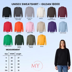 Peut inclure: Pr&eacute;sentation de sweatshirts unisexes Gildan 18000 en plusieurs couleurs, comme le noir, le gris, le rouge et l'or. L'image affiche un tableau des tailles avec des mesures en centim&egrave;tres. Une femme porte un sweat-shirt noir.