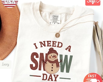 Comfort Colors® I Need A Snow Day T-Shirt | Winter Crewneck Snowman Shirt | Winter Snow Day Xmas Cozy Shirt | Snowflake Crewneck Shirt Gift