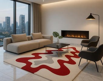 May include: A modern living room with a beige sofa, two gray armchairs, and a black coffee table. A large rug with a red, gray, and white abstract design covers the floor. A fireplace and a tall window with a city view complete the scene.