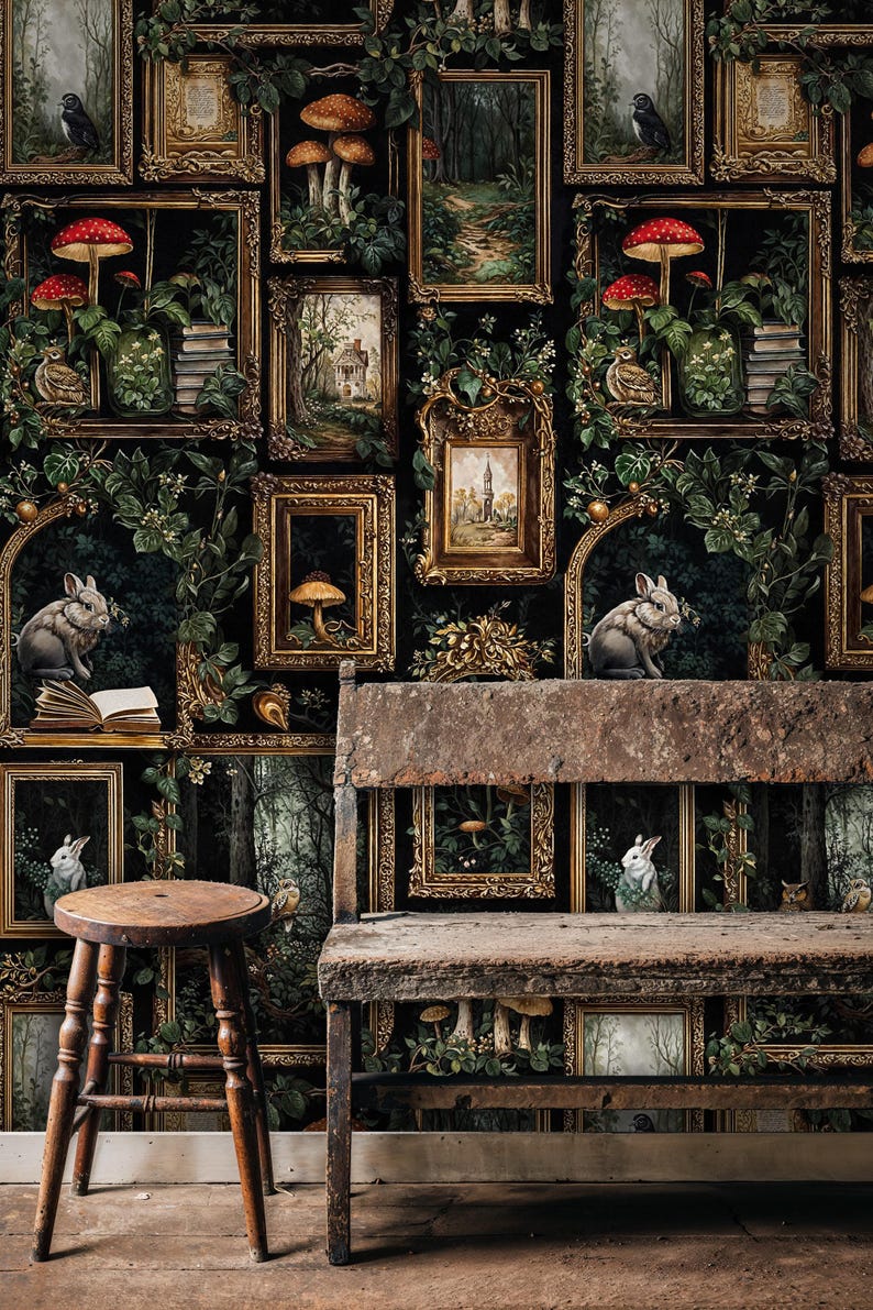 Vintage gothic gallery wallpaper with botanical forest frames, mushrooms, and woodland animals displayed behind a rustic wooden bench and stool, evoking an antique cottage library aesthetic.