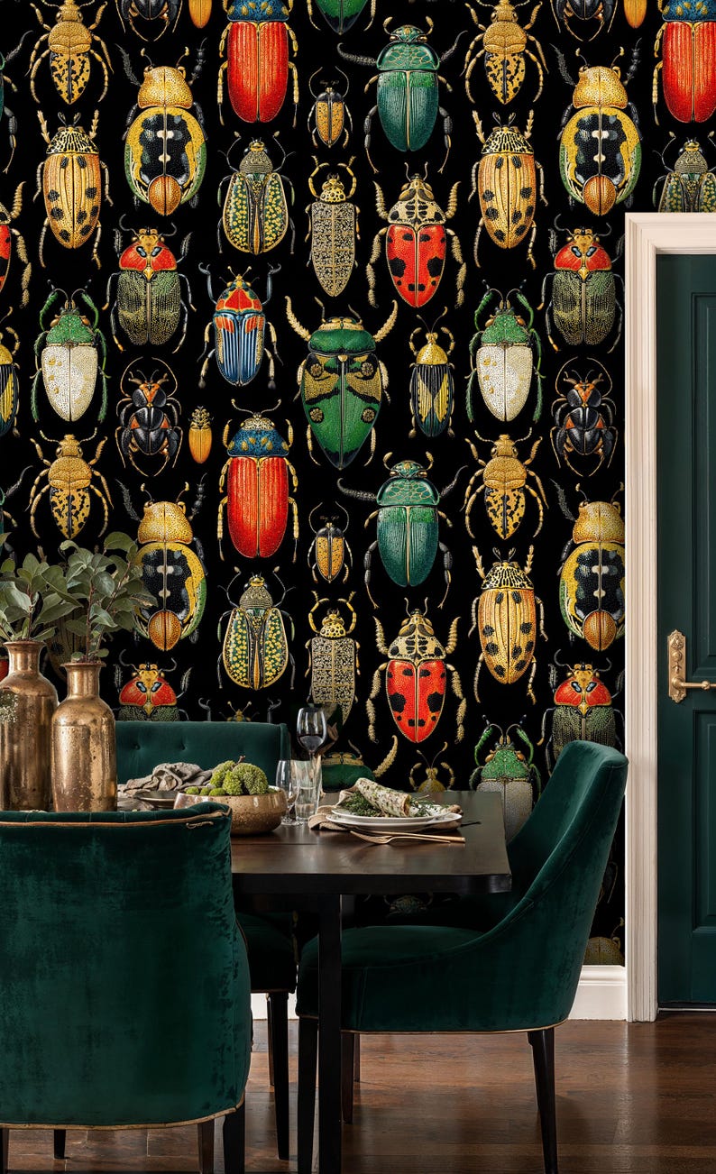 Dark beetle wallpaper in an elegant dining room with green velvet chairs, gold vases, and a dark wood table. The insect mural brings a bold, artistic, and eclectic statement to the space.