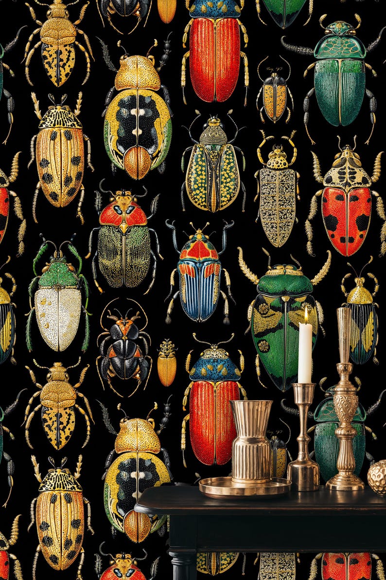 Close-up of colorful beetle wall mural with detailed insect patterns on black background. Styled with brass candle holders and decorative pieces, perfect for moody art-inspired interiors.