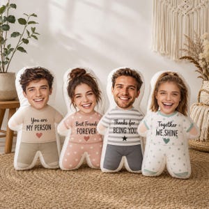 May include: Four custom-shaped plush pillows featuring photographic faces of two individuals. Each pillow displays a unique outfit with text: You are MY PERSON, Best Friends FOREVER, Thanks for BEING YOU, and Together WE SHINE, with heart and star icons.