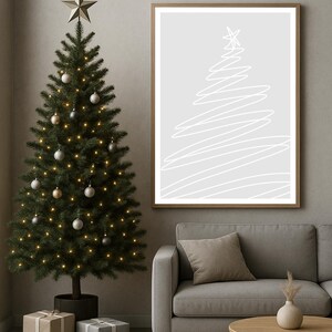 May include: A decorated Christmas tree with ornaments and lights, a framed abstract art print, and wrapped gifts. The tree is topped with a star. A gray sofa and wooden table complete the holiday scene.