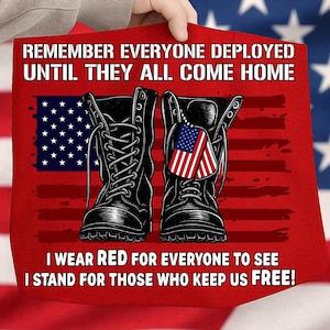 May include: Red tote bag with a graphic of black combat boots, an American flag, and the text "REMEMBER EVERYONE DEPLOYED UNTIL THEY ALL COME HOME" and "I WEAR RED FOR EVERYONE TO SEE I STAND FOR THOSE WHO KEEP US FREE!"