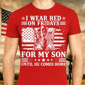May include: Red t-shirt with the text "I WEAR RED ON FRIDAYS FOR MY SON UNTIL HE COMES HOME." The design includes an American flag and combat boots. The shirt is a crew neck.