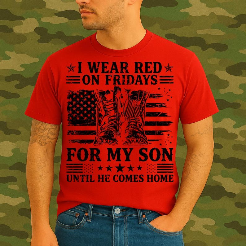 May include: Red t-shirt with the text "I WEAR RED ON FRIDAYS FOR MY SON UNTIL HE COMES HOME" and an American flag design with military boots. The shirt is worn by a person.