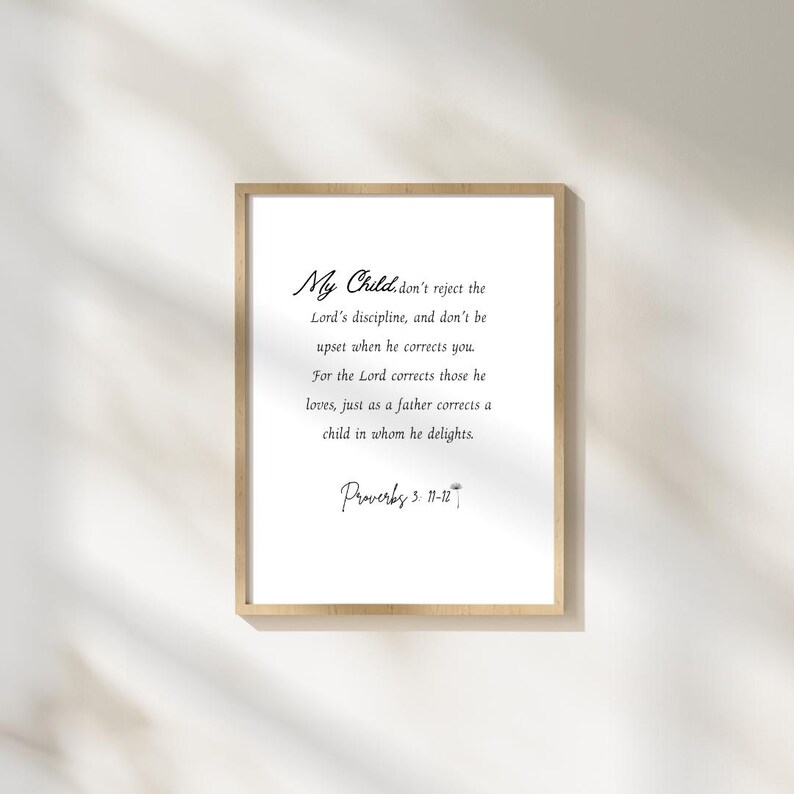May include: A framed print with the text "My Child" and a quote from Proverbs 3:11-12. The text is in a handwritten style font on a white background, framed by a light wood frame.
