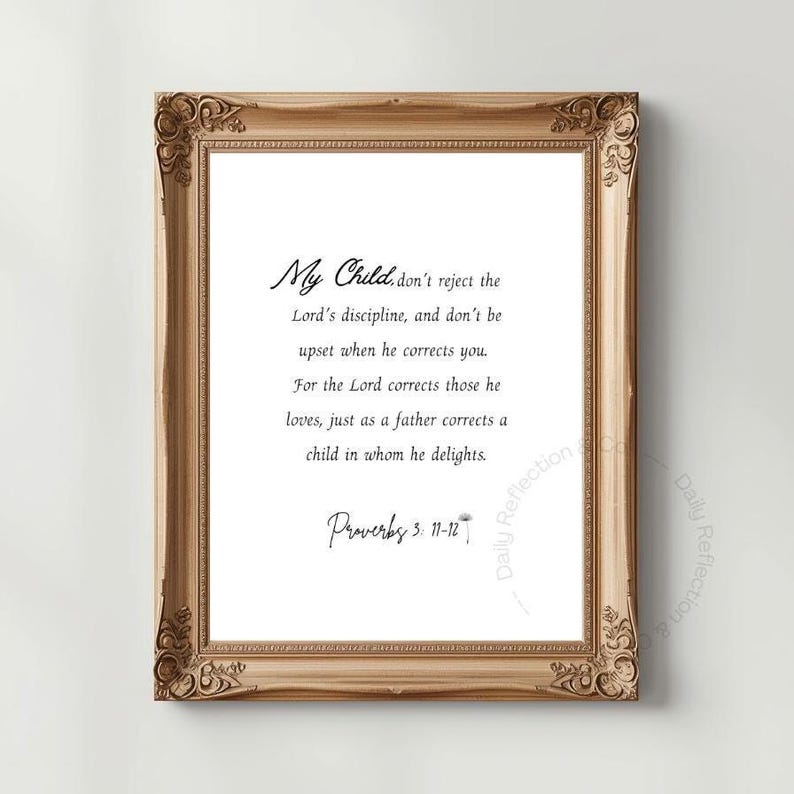 May include: A framed print with a gold-colored ornate frame. The print features elegant script text that reads "My Child... Proverbs 3: 11-12". The background is white, and the overall aesthetic is classic and inspirational.