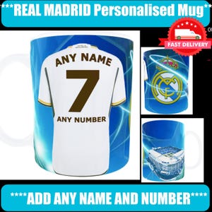 May include: A white Real Madrid mug with a personalized jersey design. The jersey features the number 7 and space for a name and number. The mug has a blue background with the text "REAL MADRID Personalised Mug" and "ADD ANY NAME AND NUMBER".