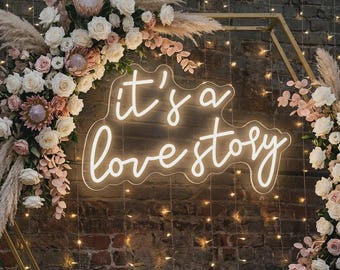 It's a Love Story Neon Sign | LED Wedding Backdrop, Bridal Shower Decor, Engagement Gift | Romantic Bedroom Wall Sign by Hey Neons