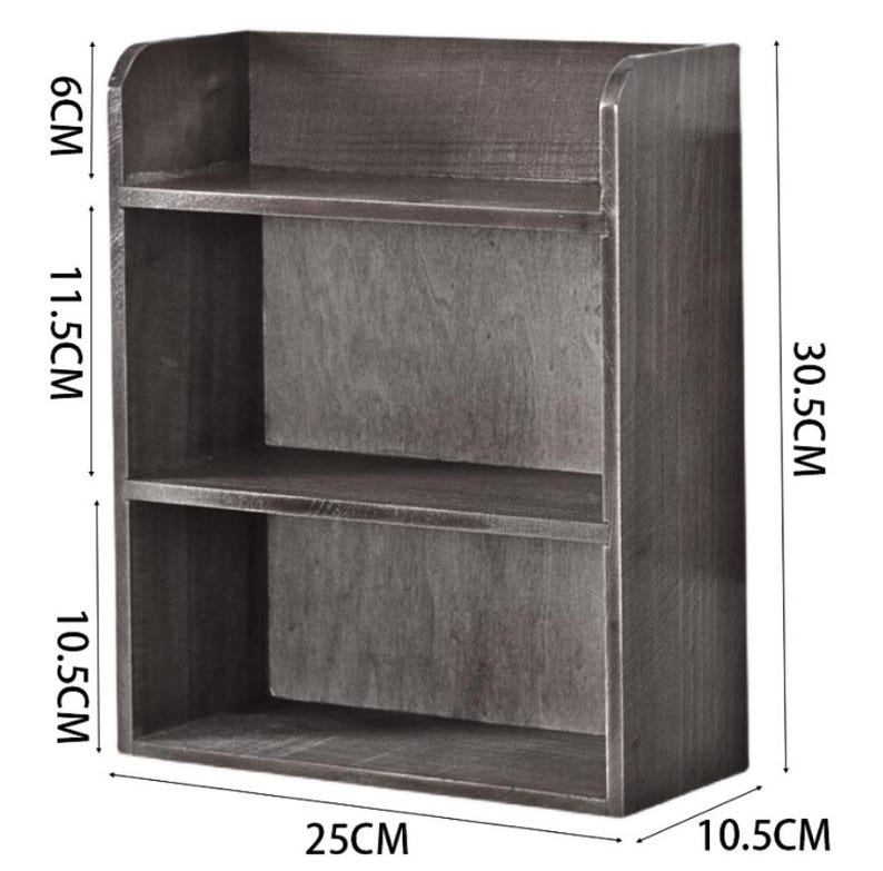 May include: A dark gray wooden shelf with two shelves and a top. The shelf is 30.5 cm high, 25 cm wide, and 10.5 cm deep. The top shelf is 6 cm high, and the middle shelf is 11.5 cm high.