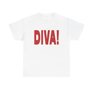 May include: White t-shirt featuring the word "DIVA!" in large, red capital letters. The tee has a crew neck and is made from a soft fabric. A simple, everyday top.
