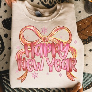 Pink and gold glitter Happy New Year text with big coquette bow and snowflakes, perfect for girly sublimation projects