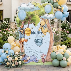 May include: A Winnie the Pooh themed birthday party sign with the text "Noah turns ONE". The sign features illustrations of Pooh, Tigger, Piglet, and Eeyore, with balloons and floral arrangements.