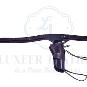 May include: A brown leather gun belt and holster set. The belt has bullet loops and a buckle. The holster is designed for a handgun. The set is made of dark brown leather.