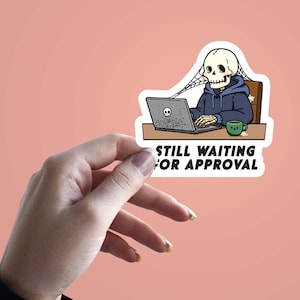 May include: A sticker depicting a cartoon skeleton in a blue hoodie, working on a laptop. The skeleton sits at a desk with a coffee mug. The text "STILL WAITING FOR APPROVAL" is printed below the image.