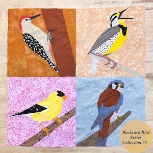 May include: A set of four fabric squares featuring different bird designs. The squares are arranged in a grid pattern. The top left square features a red-headed woodpecker on a brown background. The top right square features a yellow and black bird on a pink background. The bottom left square features a yellow bird on a pink background with white dots. The bottom right square features a blue and brown bird on a blue background. The squares are labeled "Backyard Bird Series Collection #4".