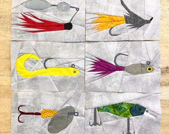 May include: Six different paper pieced fishing lure designs. The lures are made of various colors and patterns, including red, yellow, green, purple, and black. The lures are all on a white background.