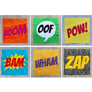 May include: Six colorful fabric squares with comic book sound effects. The words "BOOM," "OOF," "POW," "BAM," "WHAM," and "ZAP" are displayed in bold, stylized fonts. Each square has a different background color and design.