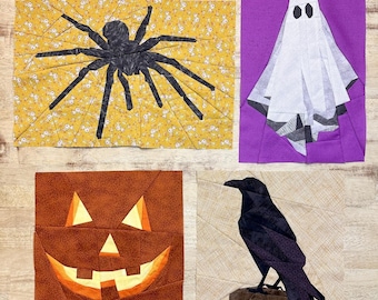 May include: Four Halloween-themed fabric squares with different designs: a black spider on a yellow background, a white ghost on a purple background, a brown jack-o'-lantern face on an orange background, and a black raven on a beige background.