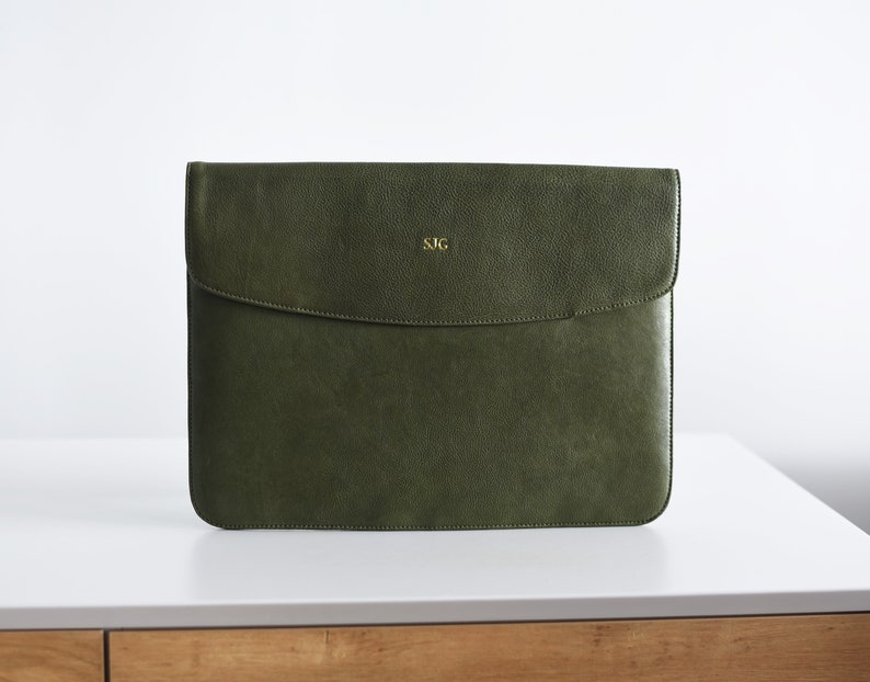 Moss green leather laptop sleeve with gold monogram—minimalist envelope case for MacBook or Surface.